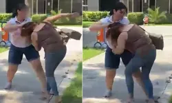 Kocasıyla birlikte bastığı kadını saçından sürükledi